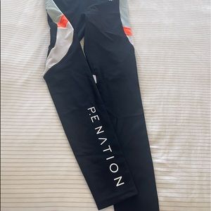 Almost brand new!! Only wore once. PE Nation First Gen Leggings in Multi Orange